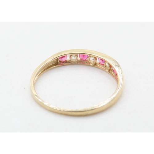 725 - Pink and Clear Gemstone Set Half Eternity Ring Mounted in 9 Carat Yellow Gold Ring Size M