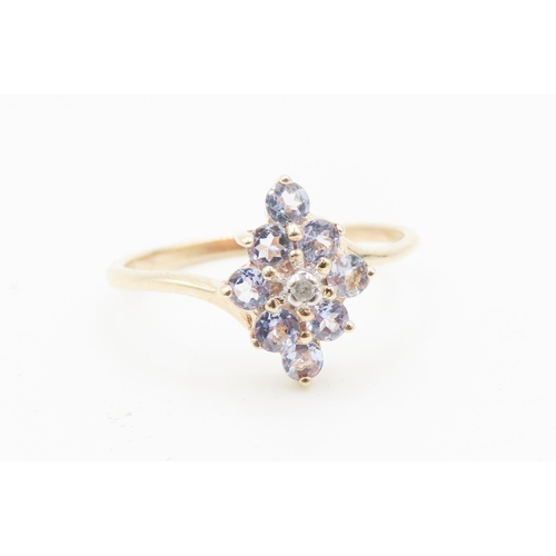 727 - Pale Tanzanite Cluster Ring Mounted in 9 Carat Yellow Gold Ring Size P