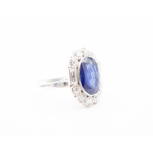 104 - Sapphire Centre Stone Ring with Round cut and Baguette Cut Diamond Halo Surround Set in Platinum Rin... 