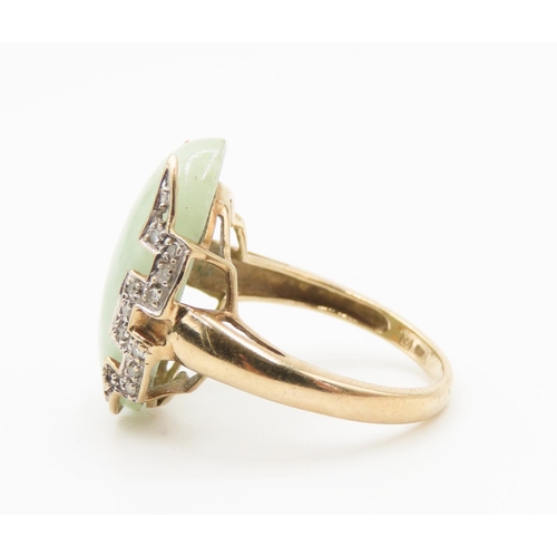 137 - Attractive Form Jade and Diamond Set Ring Mounted in 9 Carat Yellow Gold Ring Size O