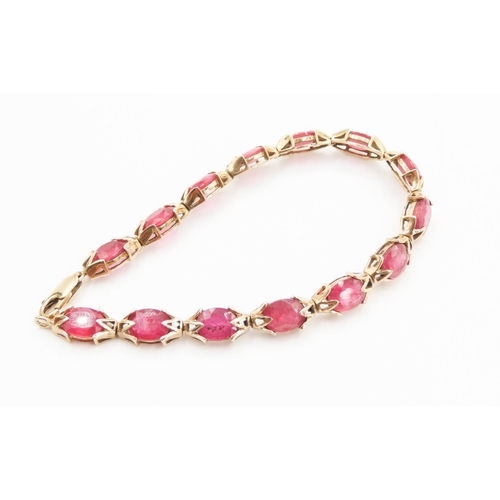 140 - Fourteen Stone Ruby Set Ladies Bracelet Attractively Detailed Mounted in 9 Carat Yellow Gold 19.5cm ... 