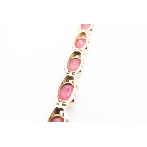 140 - Fourteen Stone Ruby Set Ladies Bracelet Attractively Detailed Mounted in 9 Carat Yellow Gold 19.5cm ... 