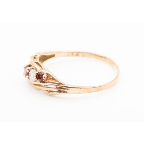 157 - Red Garnet and Gemstone Set Wave Motif Ring Mounted in 9 Carat Yellow Gold Ring Size O