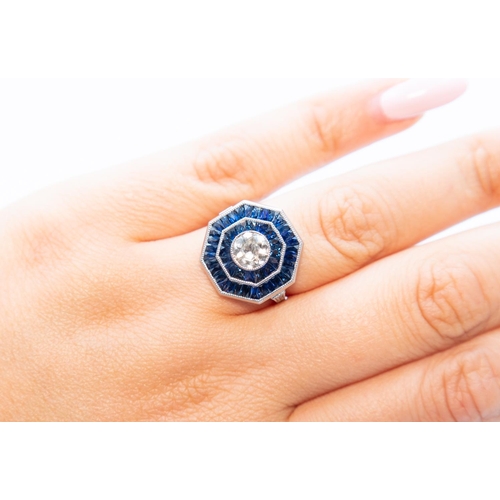 16 - Diamond and Sapphire Panel Set Ring Octagonal Form Centre Diamond 0.96 Carat Finely Incised Detailin... 