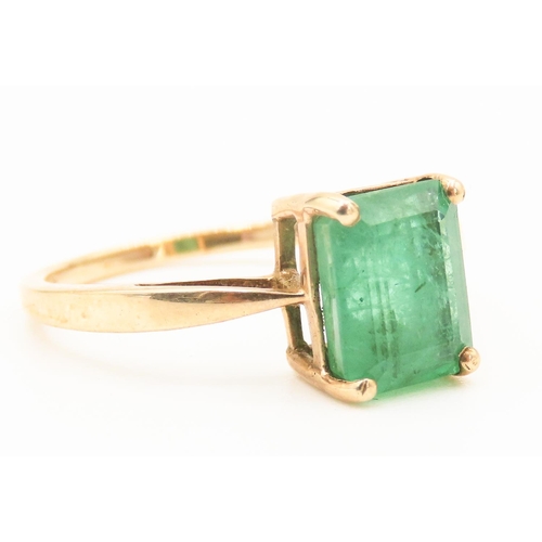 210 - Four Claw Set Emerald Single Stone Ring Mounted in 9 Carat Yellow Gold Ring Size O