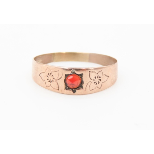 241 - Red Garnet Ring Set in 8 Carat Rose Gold with Floral Cut Decoration to Band Ring Size P and Half