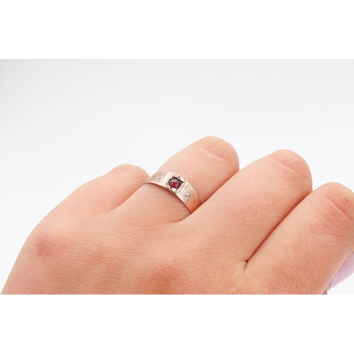 241 - Red Garnet Ring Set in 8 Carat Rose Gold with Floral Cut Decoration to Band Ring Size P and Half