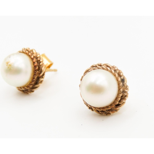 267 - Pair of 9 Carat Yellow Gold Pearl Set Earrings Braid Motif Surround  Pearls Each 7mm Diameter