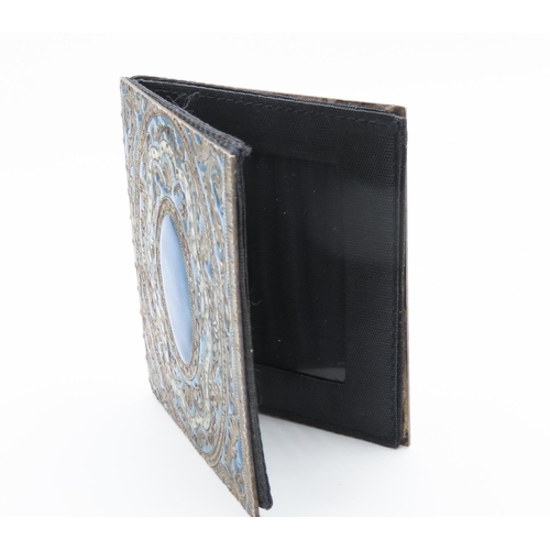 278 - Silver Mounted Enamel Work Decorated Folding Desk Top Photo Frame Double Sided 7cm Long 6cm Wide