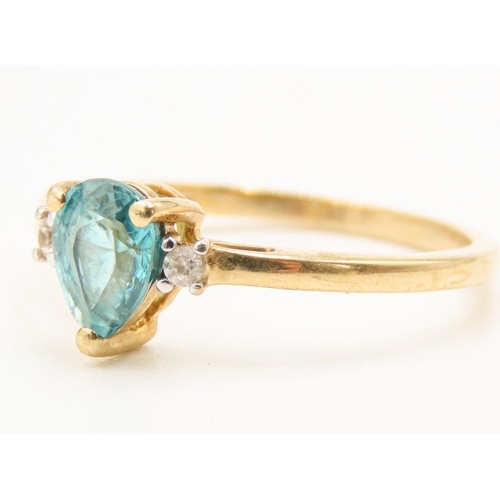 28 - Pear Cut Teal Tourmaline Set Ring Mounted in 9 Carat Yellow Gold with Further Diamonds Set to Should... 