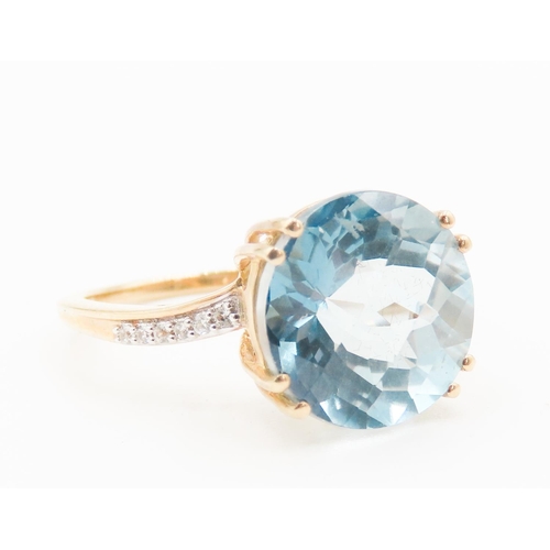 285 - Facet Cut Sky Blue Topaz Solitaire Ring Mounted in 10 Carat Yellow Gold Further Diamonds Set to Shou... 