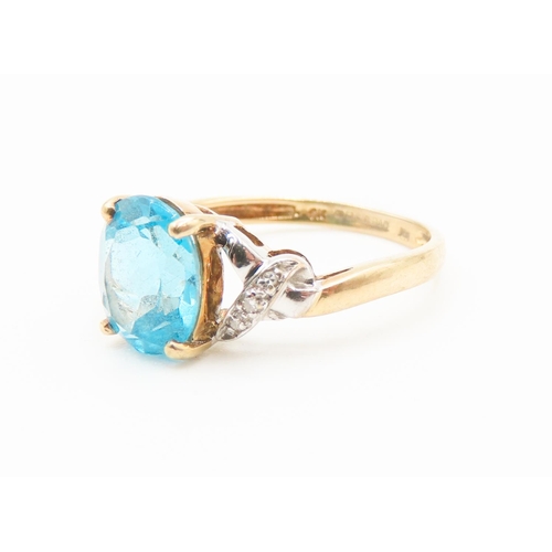 292 - Blue Topaz Centre Stone Ring Set in 9 Carat Yellow Gold Diamonds Set to Shoulder Ring Size Q