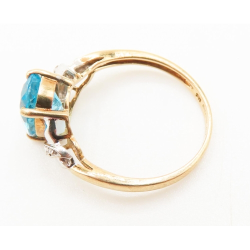 292 - Blue Topaz Centre Stone Ring Set in 9 Carat Yellow Gold Diamonds Set to Shoulder Ring Size Q