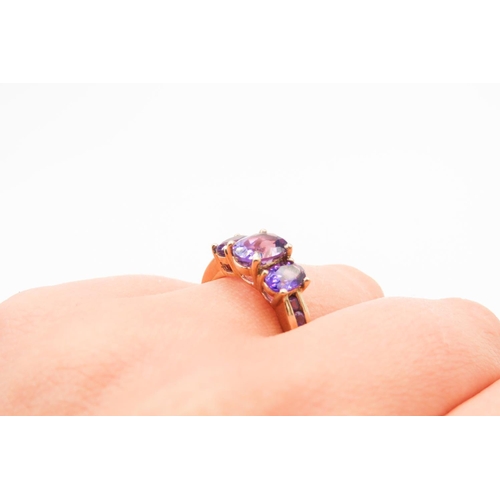 297 - Three Stone Oval Cut Amethyst set Ring Mounted in 9 Carat Yellow Gold Ring Size Q