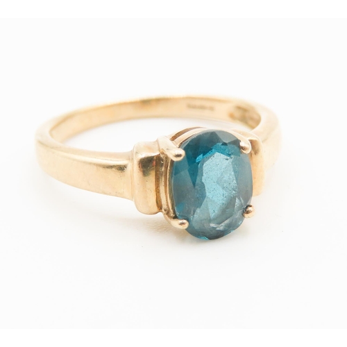 298 - Four Claw Set Blue Topaz Single Stone Ring Mounted in 9 Carat Yellow Gold Ring Size N