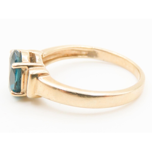 298 - Four Claw Set Blue Topaz Single Stone Ring Mounted in 9 Carat Yellow Gold Ring Size N