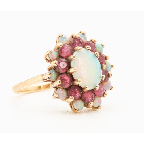 30 - Opal Centre Stone Ring with Further Ruby and Opal Halo Setting Mounted in 9 Carat Yellow Gold Ring S... 