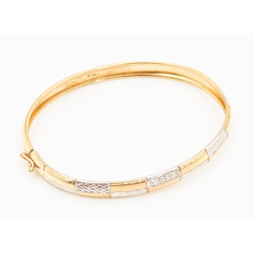 31 - 9 Carat Yellow and White Gold Bangle Bracelet with Diamond Cut Decoration Inner Width 6.5cm