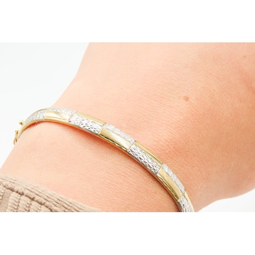 31 - 9 Carat Yellow and White Gold Bangle Bracelet with Diamond Cut Decoration Inner Width 6.5cm