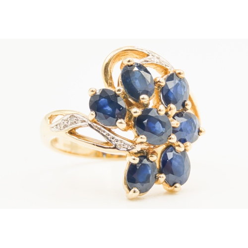 34 - Sapphire Set Seven Stone Floral Form Ring Set in 9 Carat Yellow Gold with Further Diamonds to Settin... 