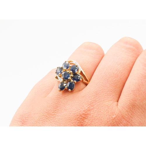 34 - Sapphire Set Seven Stone Floral Form Ring Set in 9 Carat Yellow Gold with Further Diamonds to Settin... 