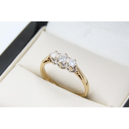 37 - Three Stone Diamond Half Bezel Set Ring Mounted in 9 carat Yellow Gold Ring Size M