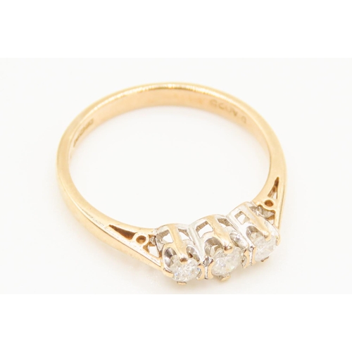 37 - Three Stone Diamond Half Bezel Set Ring Mounted in 9 carat Yellow Gold Ring Size M