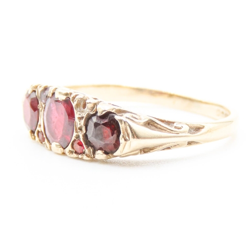 453 - Three Stone Red Garnet Ring Set in 9 Carat Yellow Gold with Further Garnet Decoration to Settings Ri... 