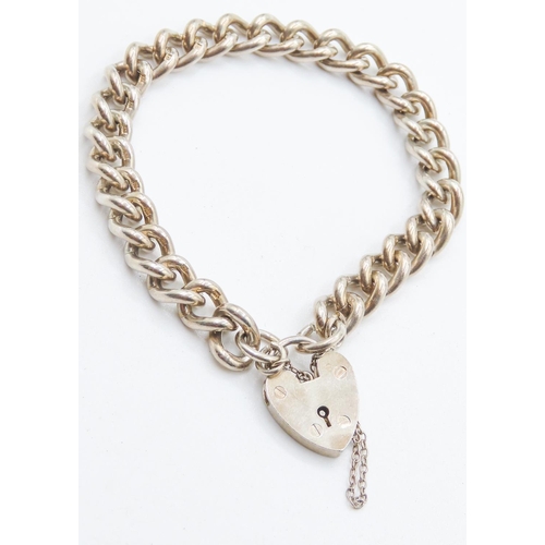 484 - Silver Curb Link Bracelet with Heart Form Clasp and Safety Chain 16.5cm Long