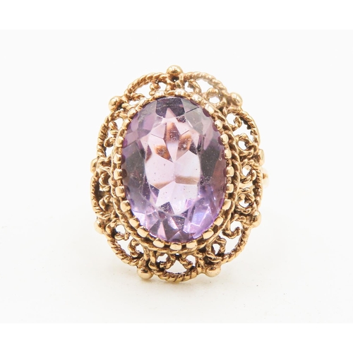 7 - Amethyst Single Stone Ring Finely Detailed Attractively Set in 9 Carat Yellow Gold Ring Size M