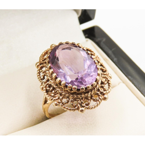 7 - Amethyst Single Stone Ring Finely Detailed Attractively Set in 9 Carat Yellow Gold Ring Size M