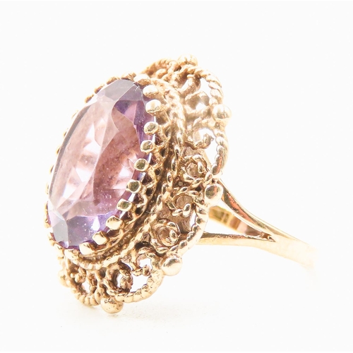 7 - Amethyst Single Stone Ring Finely Detailed Attractively Set in 9 Carat Yellow Gold Ring Size M