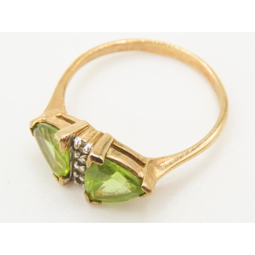 78 - Triangle Cut Peridot Twin Stone Ring Mounted in 9 Carat Yellow Gold Ring Size N and a Half