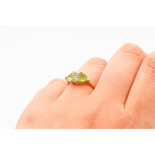 78 - Triangle Cut Peridot Twin Stone Ring Mounted in 9 Carat Yellow Gold Ring Size N and a Half