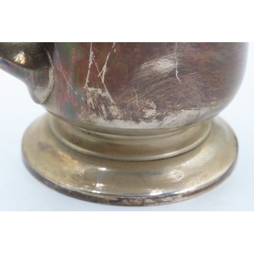 547 - Silver Cup With Shaped Handle above Turned Base Approximately 12cm High