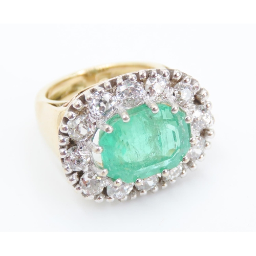 103 - Emerald Set Centre Stone Ring Mounted in 18 Carat Yellow Gold Diamond Set Halo Surround Total Emeral... 