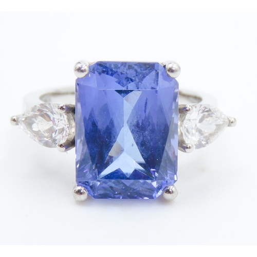 104 - Exceptional Emerald Cut Tanzanite and Pear Cut Diamond Set Three Stone Ring Mounted in 18 Carat Whit... 