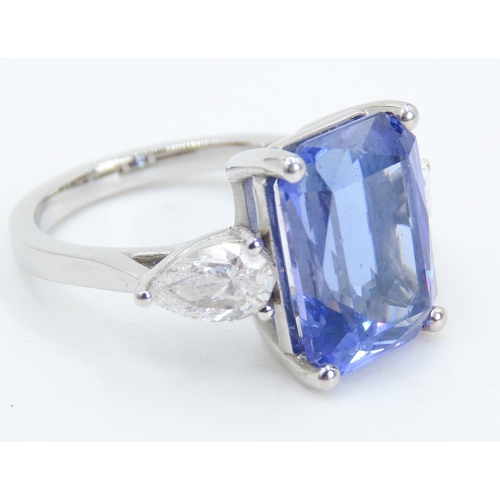 104 - Exceptional Emerald Cut Tanzanite and Pear Cut Diamond Set Three Stone Ring Mounted in 18 Carat Whit... 