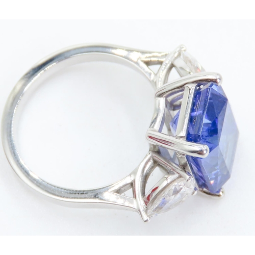 104 - Exceptional Emerald Cut Tanzanite and Pear Cut Diamond Set Three Stone Ring Mounted in 18 Carat Whit... 