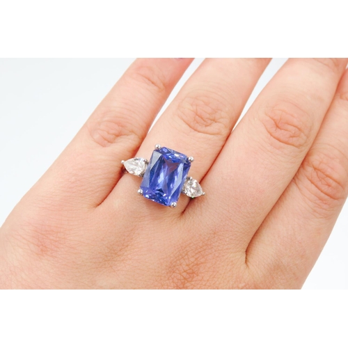 104 - Exceptional Emerald Cut Tanzanite and Pear Cut Diamond Set Three Stone Ring Mounted in 18 Carat Whit... 