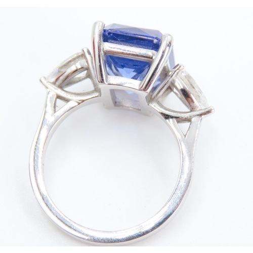 104 - Exceptional Emerald Cut Tanzanite and Pear Cut Diamond Set Three Stone Ring Mounted in 18 Carat Whit... 