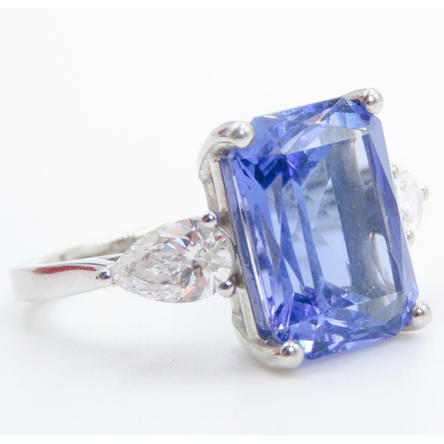 104 - Exceptional Emerald Cut Tanzanite and Pear Cut Diamond Set Three Stone Ring Mounted in 18 Carat Whit... 