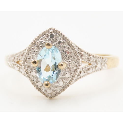 121 - Aquamarine Centre Stone Ring Attractively Detailed Set in 9 Carat Yellow Gold Further Diamond Set Su... 