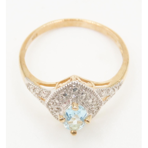 121 - Aquamarine Centre Stone Ring Attractively Detailed Set in 9 Carat Yellow Gold Further Diamond Set Su... 