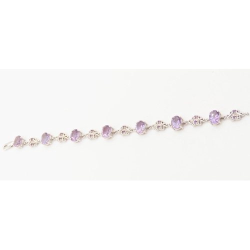 125 - Seven Stone Amethyst Set Bracelet Floral Detailing to Setting Mounted on 9 Carat White Gold 19cm Lon... 