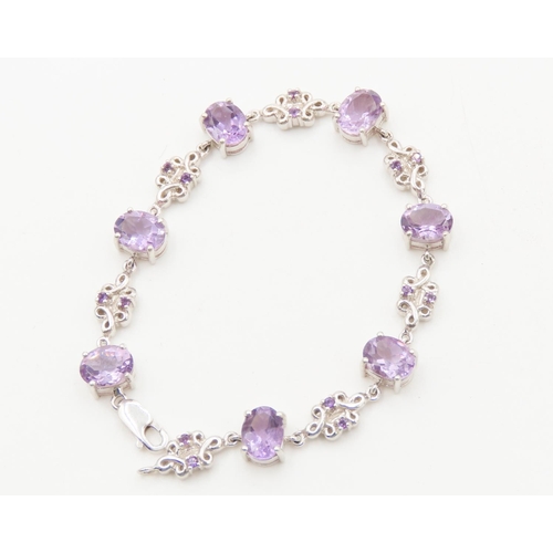 125 - Seven Stone Amethyst Set Bracelet Floral Detailing to Setting Mounted on 9 Carat White Gold 19cm Lon... 