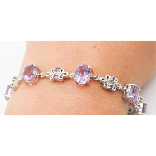 125 - Seven Stone Amethyst Set Bracelet Floral Detailing to Setting Mounted on 9 Carat White Gold 19cm Lon... 