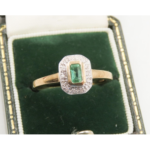 126 - Bezel Set Emerald Centre Stone Ring Diamond Halo Surround Mounted in 9 Carat Yellow Gold Ring Size Q