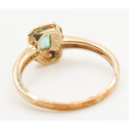 126 - Bezel Set Emerald Centre Stone Ring Diamond Halo Surround Mounted in 9 Carat Yellow Gold Ring Size Q