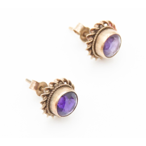 138 - Pair of Bezel Set Amethyst Earrings Mounted in 9 Carat Yellow Gold Each 1cm Diameter